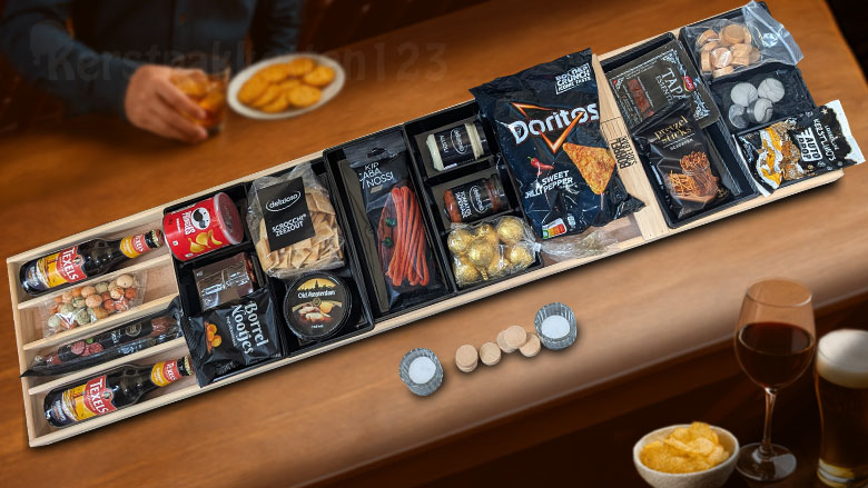Sjoel de kerst in! Een stoer kerstpakket met luxe borrelsjoelbak, heerlijke snacks en speciaalbier – voor een avond vol plezier en gezelligheid