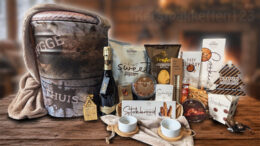 Luxe kerstpakket met Scandinavische opbergpoef, plaid en Prosecco voor een warme, sfeervolle kerst.